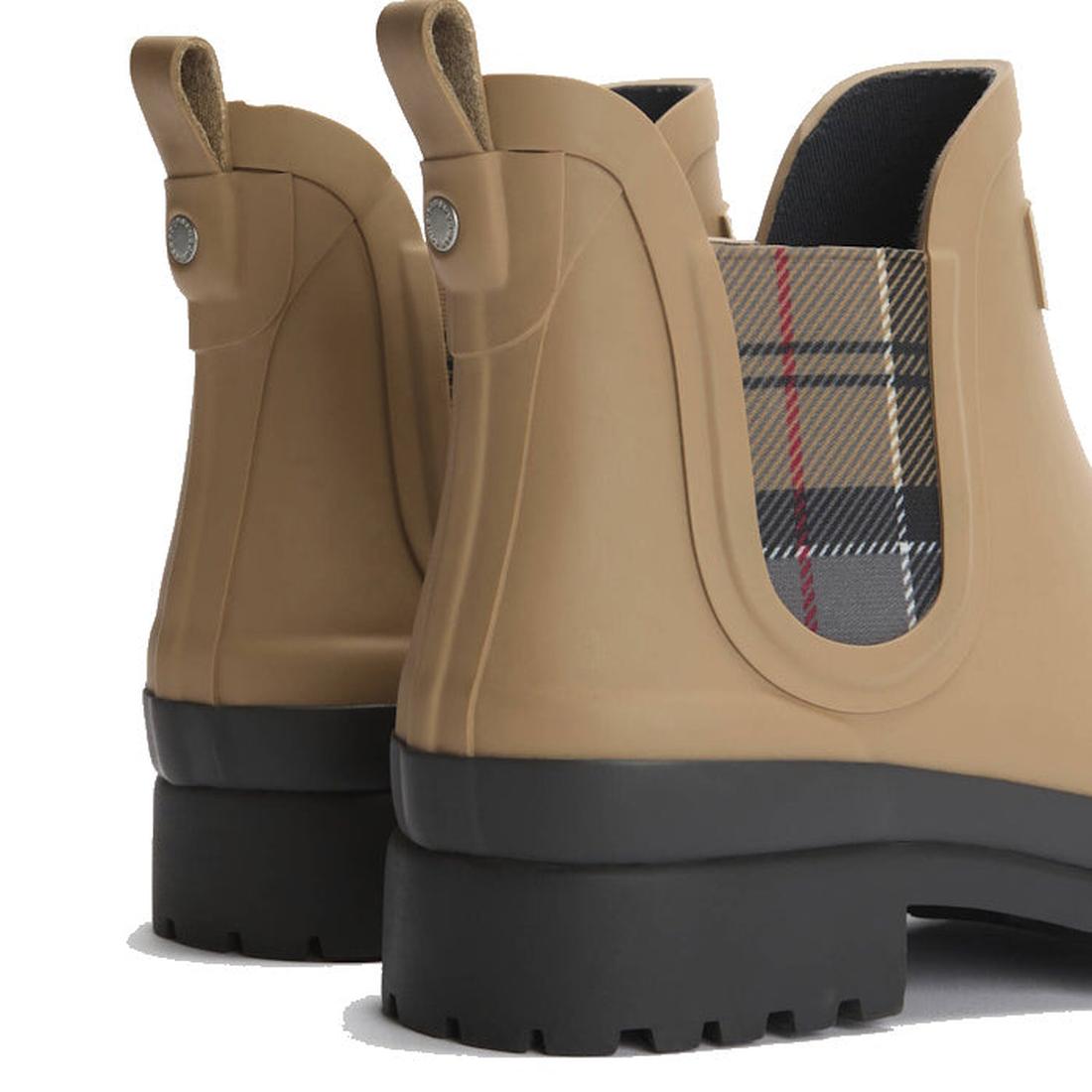 Close-up of the Barbour Mallow Beige Dress Tartan Chelsea Women's Wellington Rainboots, featuring tan weatherproof rubber, thick black soles, and plaid fabric side panels., 5063669170830, 5063669170847, 5063669170854, 5063669170861, 5063669170878, 51814, 