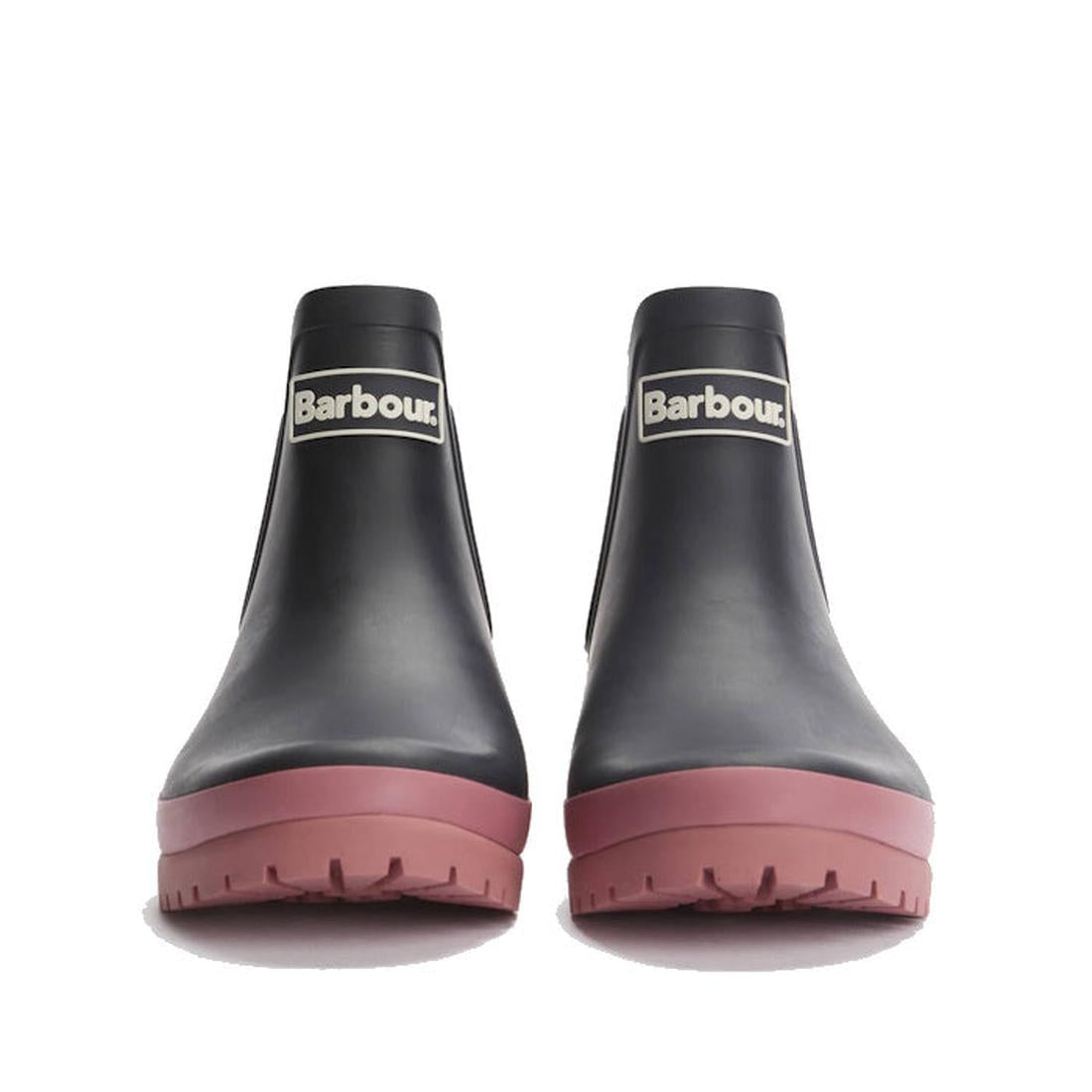 A pair of Barbour Mallow Navy Cherry Blossom Chelsea Womens Wellington Rainboots with thick, matte dark pink soles, shown front-facing on a white background. These waterproof ankle boots display the Barbour logo on the front., 5063669170908, 5063669170915