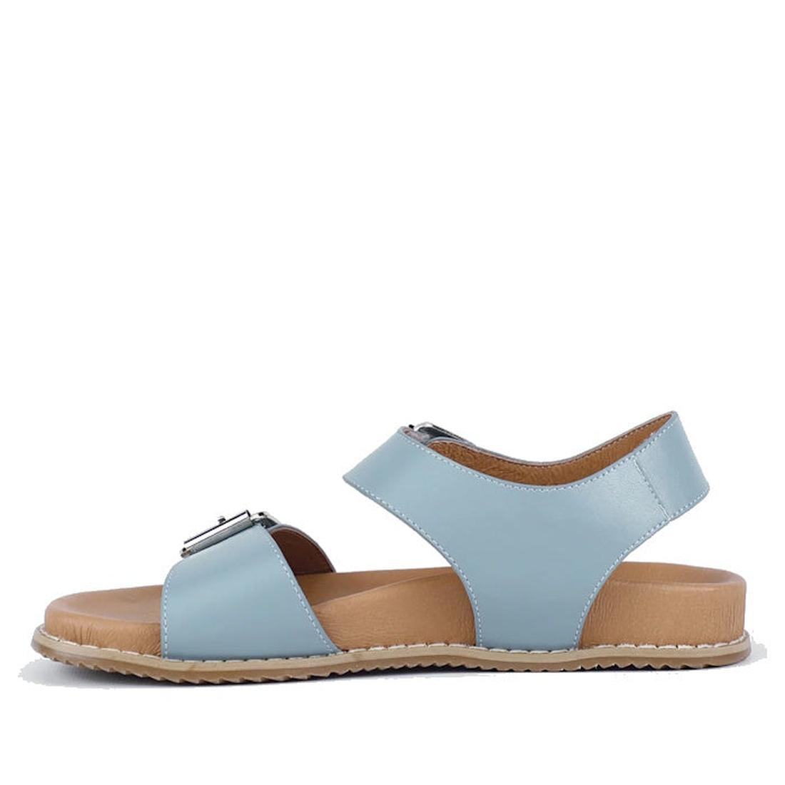 The Bay Lane Zeus Denim Blue Women's Leather Sandal features two adjustable straps, a back strap, a beige Luxe Support footbed, and a light brown sole. Shown in side view on a white background., 9357649063806, 9357649063813, 9357649063820, 9357649063837, 