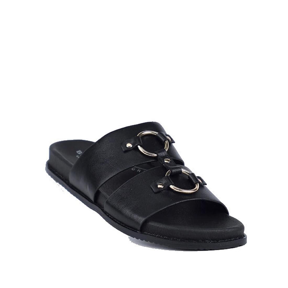 The Bay Lane Zuma Black Women's Leather Sandal features two wide straps with metallic ring accents, a cushioned footbed, and a flat sole—perfect leather slide sandals for effortless style and comfort.