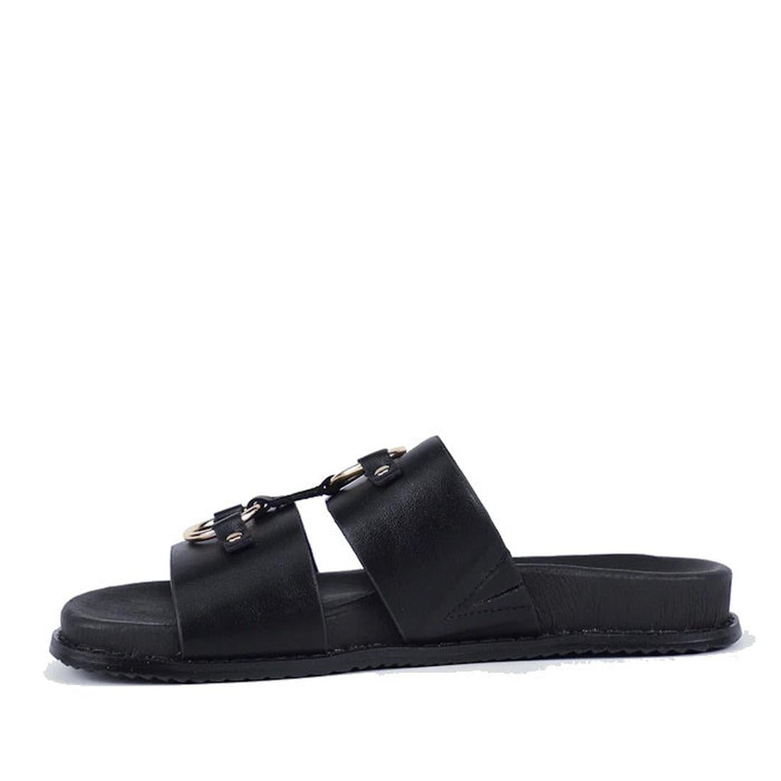 The Bay Lane Zuma Black Womens Leather Sandal features two wide straps with metallic buckles, a cushioned footbed, and flat sole. This minimalist slip-on mule is shown against a plain white background., 9357649065015, 9357649065022, 9357649065039, 9357649