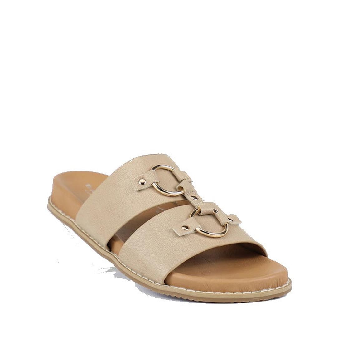 The Bay Lane Zuma Latte Beige Womens Leather Sandal features two wide straps with gold horsebit details, a cushioned footbed, flat sole, and visible edge stitching for both comfort and style.