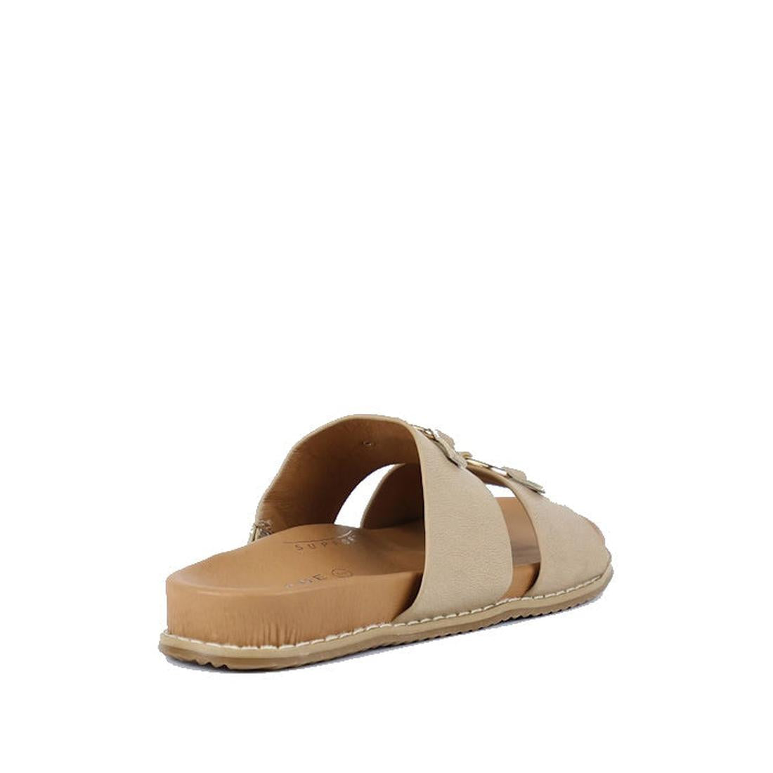 The Bay Lane Zuma Latte Beige Womens Leather Sandal features two wide tan leather straps, a flat cushioned sole, and visible white edge stitching, shown from a rear side angle on a white background., 9357649064940, 9357649064957, 9357649064964, 9357649064