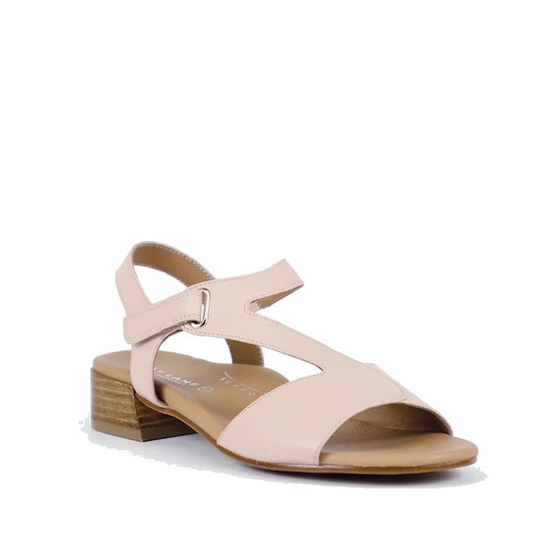 The Bay Lane Dune Womens Leather Low Heel Sandal in blush pink features an open toe, cushioned footbed, low wooden block heel, side cutout details, and an adjustable ankle strap with buckle.