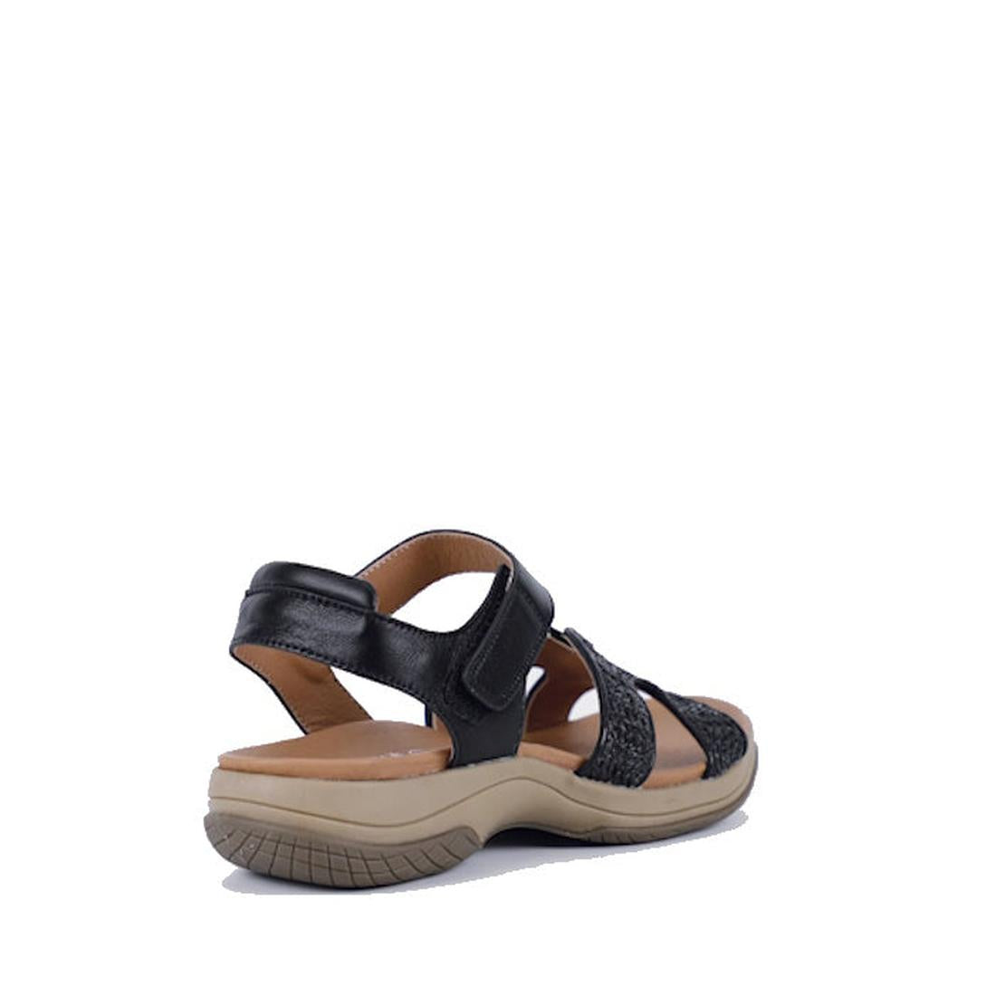 The Bay Lane Torquay Black Raffia Women's Leather Sandal features black straps, a beige cushioned sole with raffia-inspired detail, a low heel, and an adjustable ankle strap. Shown from the back left angle., 9357649061642, 9357649061659, 9357649061666, 93