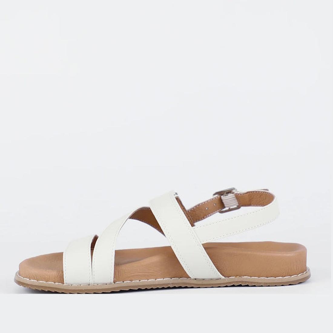 The Bay Lane Zorba Ice White Womens Leather Flat Sandal features a strappy white leather design, cushioned footbed, and adjustable back strap with silver buckle, shown in side profile on a plain white background., 9357649064407, 9357649064414, 93576490644
