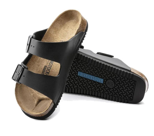 A pair of Birkenstock Arizona PROF Birko Flor Black Regular Width sandals with two adjustable straps and cork footbeds, one upright and one on its side to display the oil- and grease-resistant non-slip super grip sole.