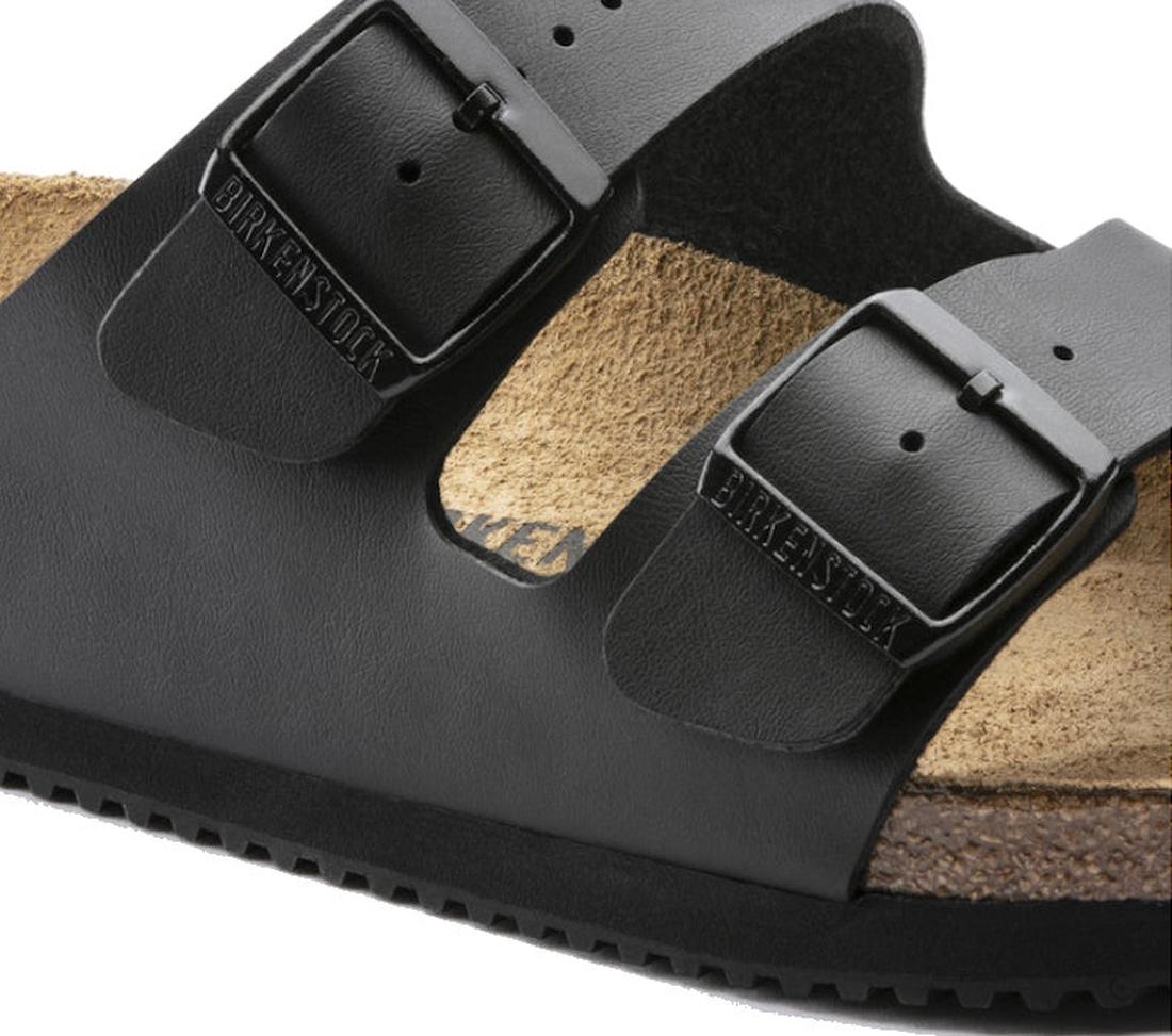 Close-up of the Birkenstock Arizona Velvet Grey Birkibuc – Regular Fit, featuring two adjustable buckle straps and a contoured cork-latex footbed with a textured sole., 48705, 48706, 4066648916567, 4066648916604, 4066648916642, 4066648916680, 406664891672