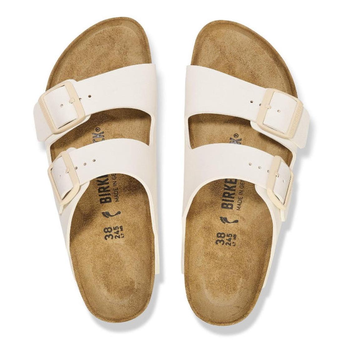 Top down view of Arizona Eggshell White Birkenstock Birko Flor sandals with beige soles on a white background. Showing buckle adjustable double straps.,
4066648369509,
4066648369547,
4066648369585,, 46716, 46717, 4066648369509, 4066648369547, 406664836958