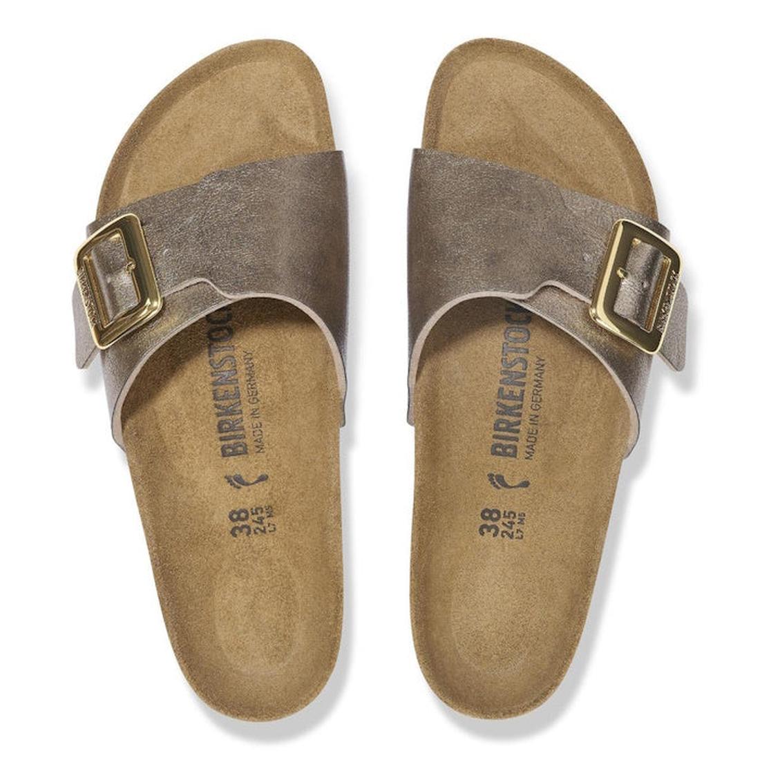 A pair of Birkenstock Womens Catalina Cushion Buckle sandals in Graceful Taupe (Birko-Flor, regular width) with single wide straps and gold buckles, displayed top-down on a white background; cork-latex footbeds show size and brand markings., 4067707018482
