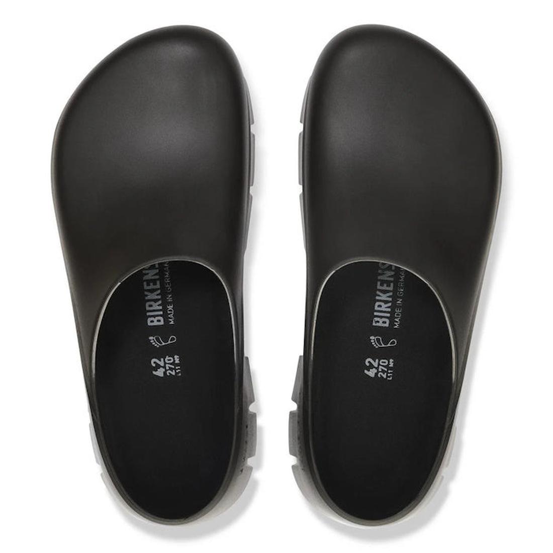 A pair of BIRKENSTOCK Super Birki 2.0 Polyurethane clogs in black, regular width, shown from above with visible logo and size details on the insole. These slip-resistant, closed-toe clogs feature a simple rounded design., 50301, 4061418845184, 40614188452