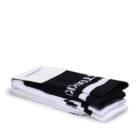 The BIRKENSTOCK Crew Cotton Tennis Striped Socks 2 Pair Pack in Black/White, made from organic cotton for softness, features bold stripes, branding, a comfort sole, and comes neatly folded with a branded cardboard label.