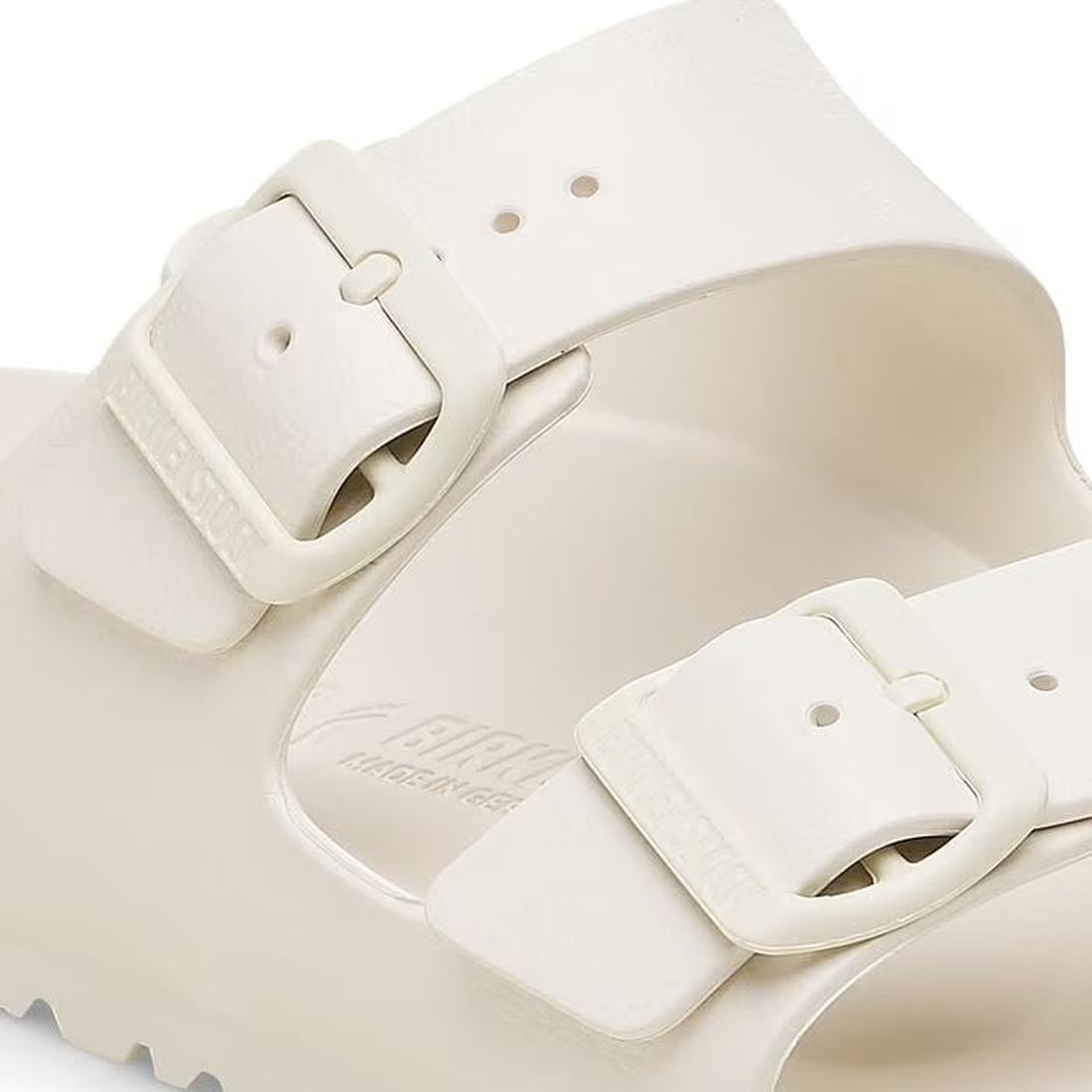 Close-up of the Birkenstock Arizona EVA Eggshell Off White Narrow Width sandal, featuring two adjustable buckles, a textured EVA footbed, and detailed views of the sole and straps., 47533, 47534, 4066648352167, 4066648352204, 4066648352242, 4066648352280