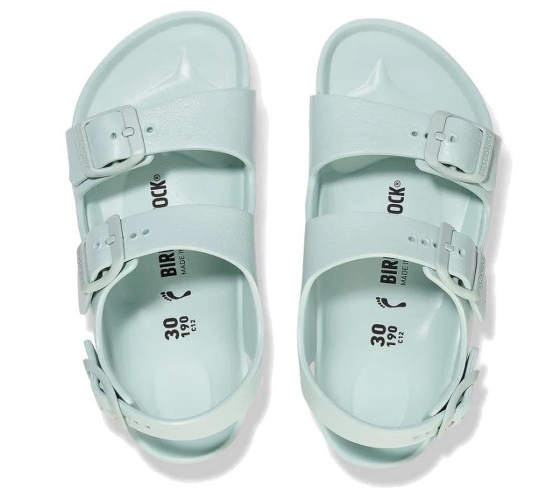 A pair of Birkenstocks Kids Surf Green Milano EVA Sandal Narrow Width, featuring two adjustable buckle straps, is displayed top-down on a white background., 47650, 4066648099420, 4066648099468, 4066648099529, 4066648099543, 47655, 47656, 47657