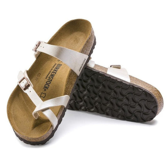 A pair of Birkenstock Mayari Birko Flor Birkibuc Graceful Pearl White sandals (Regular Width) with adjustable straps and cork footbeds, one sandal resting on its side to display the textured black sole.