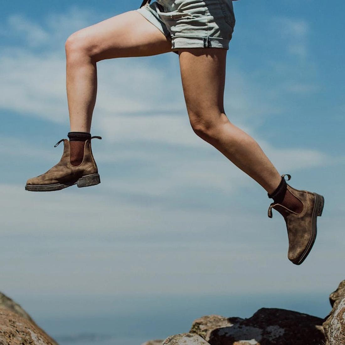 a women jumping from rocks wearing a pair of blundstone chelsea 1306 boots.  The boots showing wear but still with a lot of life left.
9315891441018,
9315891441032,
9315891441056,
9315891441070,
9315891441094,
9315891441117,
9315891441131,
9315891441155,
