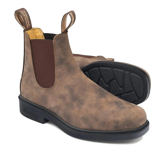 a pair of blundstone brown 1306 chelsea boots. One showing the side and upper, the other showing part of the sole.