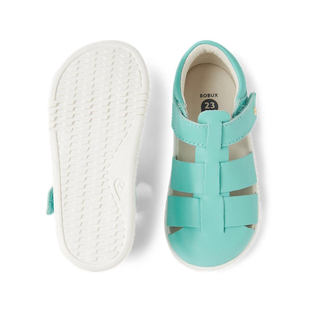 The Bobux Iwalk IW Quick Dry Tidal Sandal in Pool Blue features turquoise uppers, white textured soles, adjustable straps, and an open toe. Made from quick dry leather, these children's sandals offer lasting comfort., 9420068557796, 9420068557802, 9420068