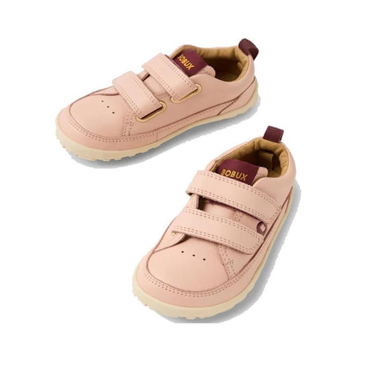 A pair of pink Bobux toddlers leather sneakers with Velcro straps and a flat sole.