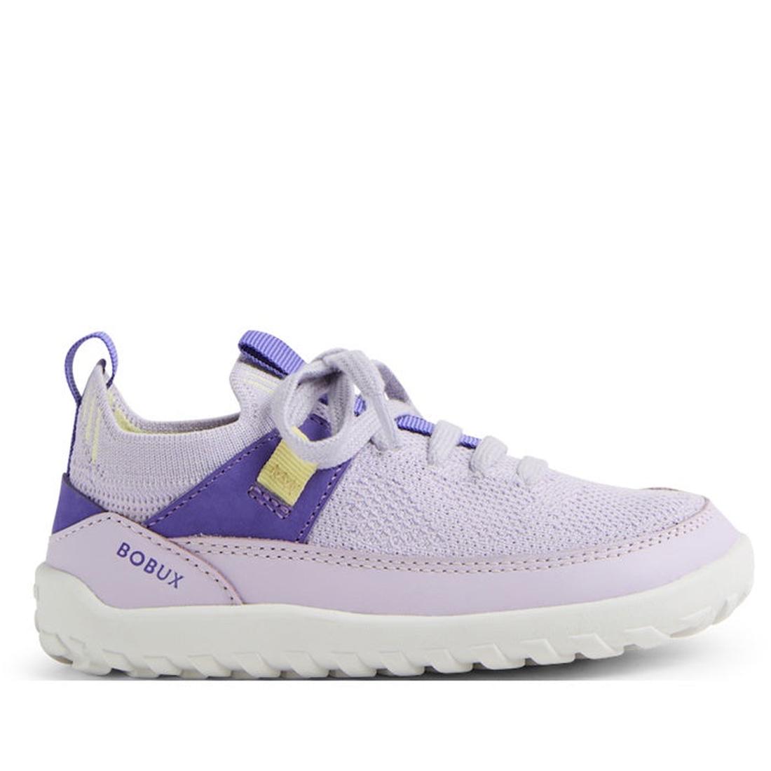 The Bobux Iwalk Meta Sneakers Thistle Lavender are light purple stretchy knit sneakers with lavender and purple accents, a white non-slip outsole, yellow tag, and BOBUX branding on the heel, shown side profile on a white background.