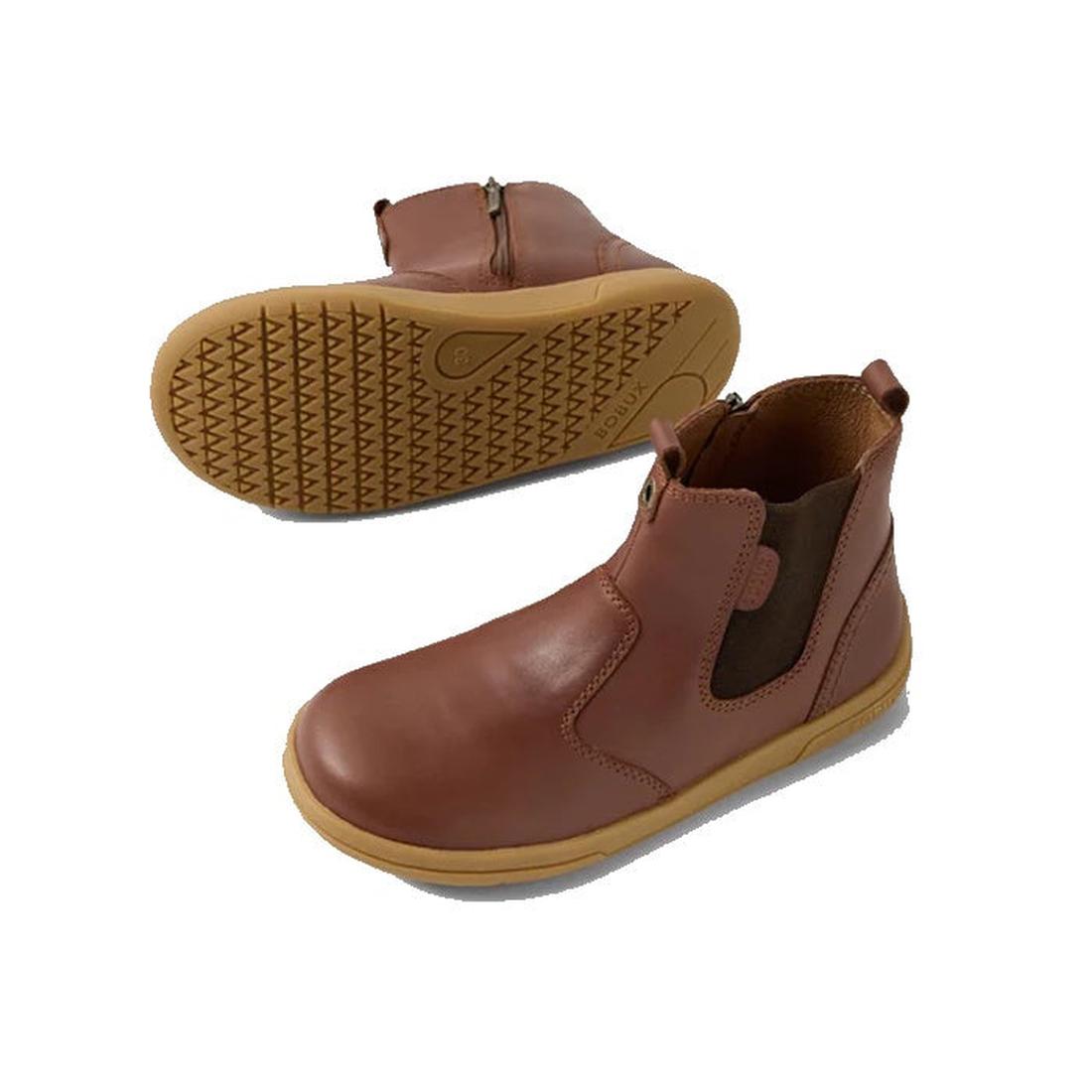 Bobux KP Kids Plus Jodhpur 2 II Juniors Leather Boot Toffee features brown leather, side zippers, elastic panels, and a flexible sole. One boot is shown from the side; the other highlights its textured rubber sole for extra grip.