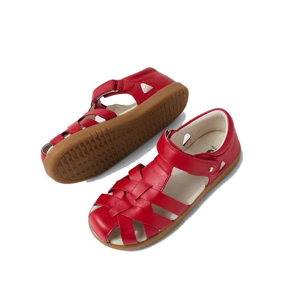 The Bobux Kids Plus KP Tropicana II Salsa Red Closed Toe Leather Sandal features a woven leather design, Velcro strap, brown rubber soles, and water resistance—perfect for kids’ comfort and all-day play. Displayed on a white background., 9420074865311, 94