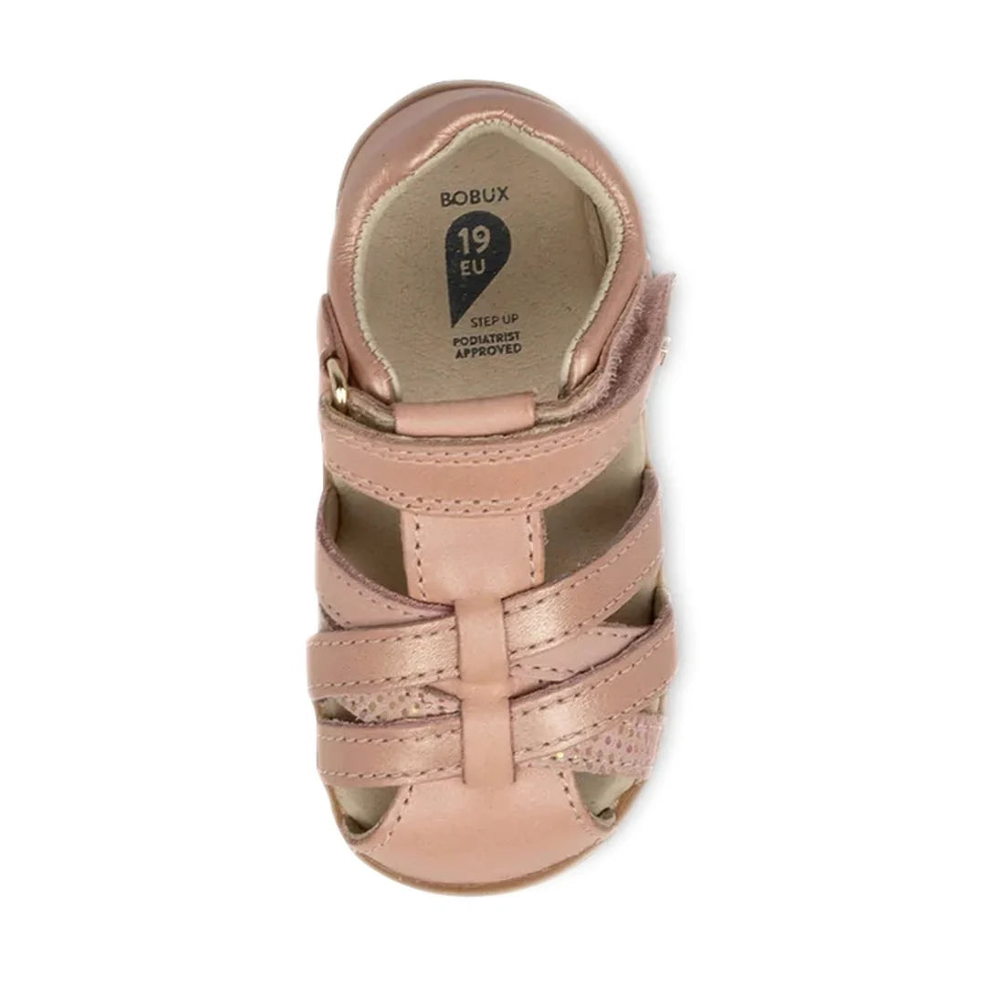 A single Bobux Step Ups Cross Jump Dusk Pearl Pink Closed Toe Sandal for toddlers, specially designed as an ideal first walkers kids’ sandal with an open toe and closed heel. It features two front straps and one ankle strap, while the insole displays the 