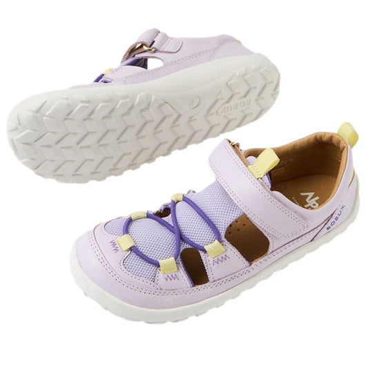 Bobux Kid+ Rocky Sandals in soft Thistle Lavender, closed toe, white zero-drop soles, yellow pull tabs, and easy hook-and-loop straps.  ksnz
