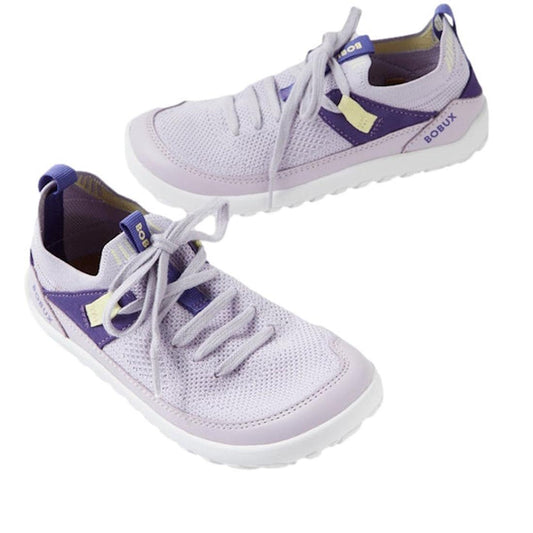 The Bobux Kid+ Meta Knit Barefoot Sneaker in Thistle Lavender features breathable mesh uppers, light purple and yellow accents, white soles, and BOBUX branding on the side and tongue—perfect for stylish juniors.