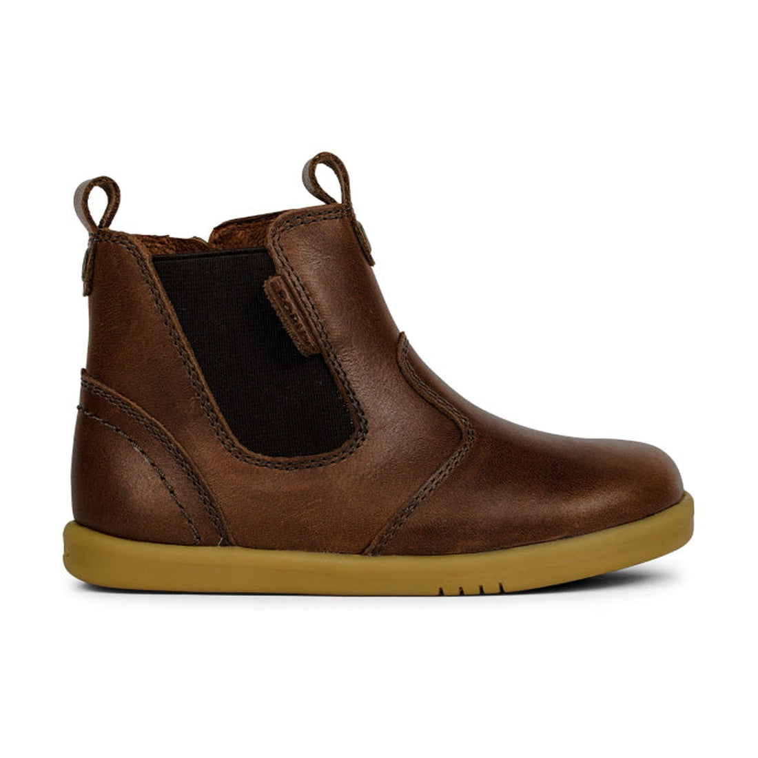 The Bobux IWalk Jodhpur Boot Toffee 620826A is a brown kids' leather boot with a tan rubber sole, black elastic side panel, pull tabs, and visible stitching. Enjoy free shipping New Zealand wide., 9420062046678, 9420062046685, 9420062046692, 9420062046708