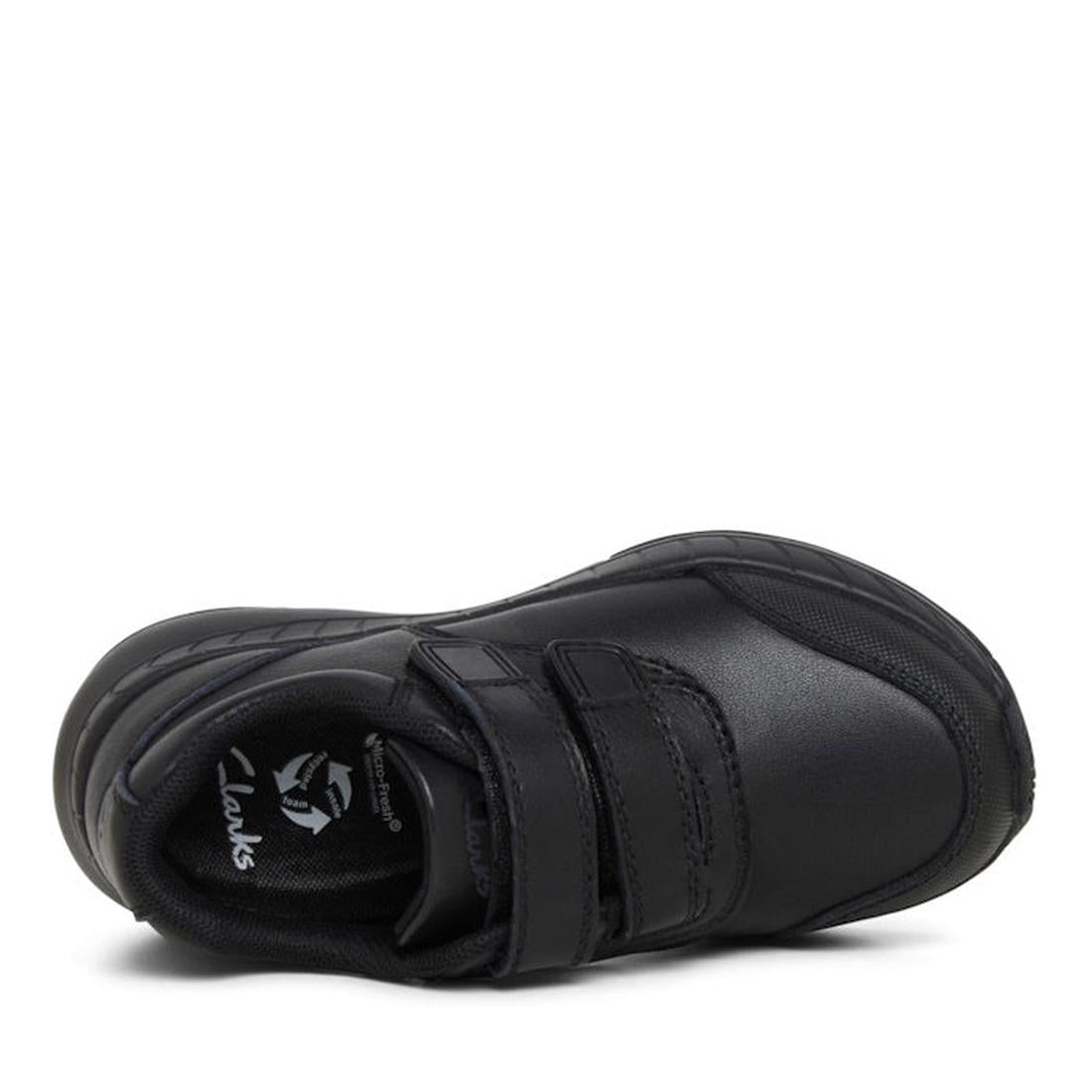 The Clarks Hurry Black Leather School Shoe for children is shown from above, with a scuff-resistant toe, two Velcro straps, and the Clarks logo visible on the black insole., 34987, 34988, 34989, 34990, 9336078625489, 9336078625502, 9336078625526, 93360786