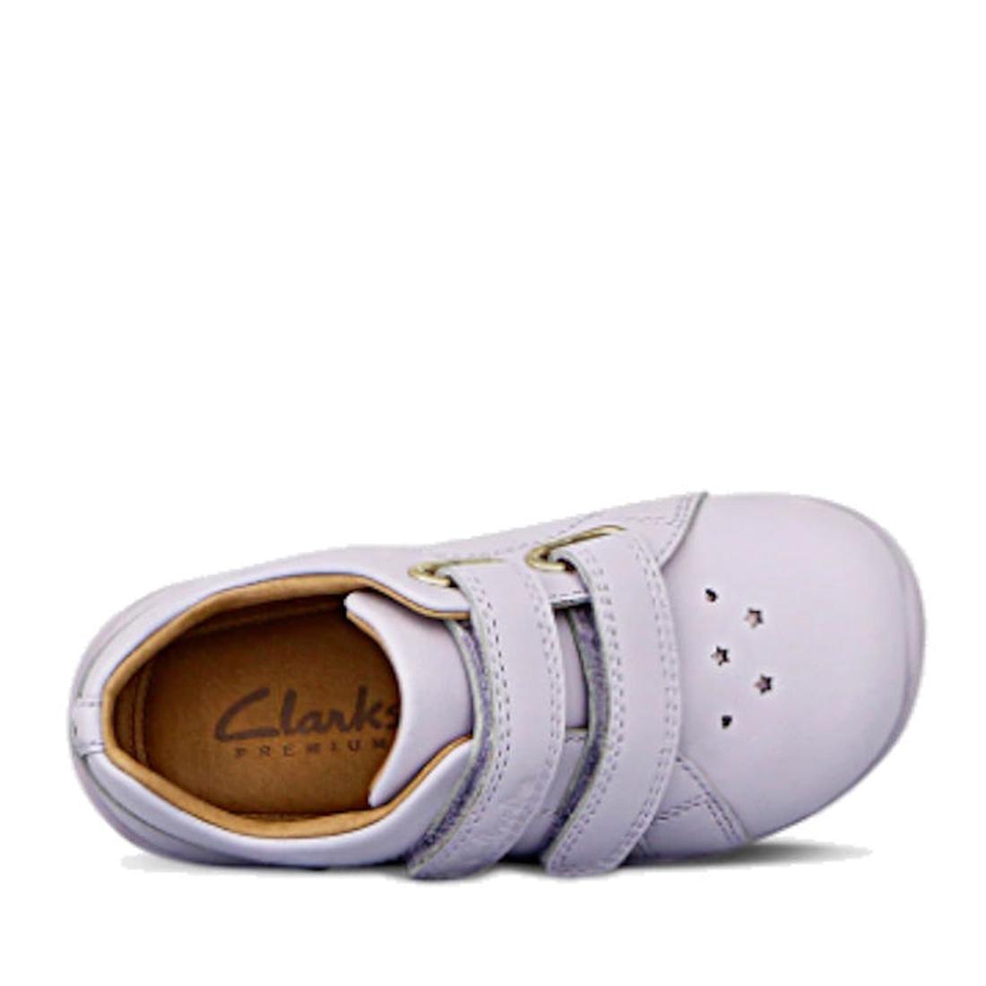 The Clarks Toddlers Macy Lilac Leather Trainer features two velcro straps, star cutouts on the toe, and a tan insole with the Clarks logo—a comfortable and stylish light purple sneaker for kids., 9336078203618, 9336078203656, 9336078203694, 9336078203731,