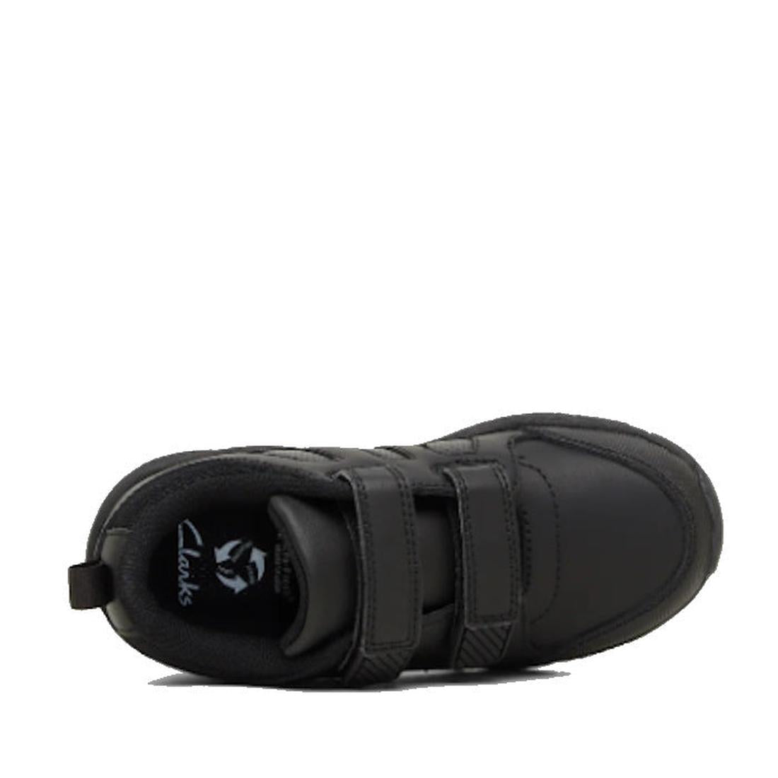 The Clarks Noah Black School Trainer is a black sports shoe with two Velcro straps, a rounded toe, padded collar, memory foam insole, and the Clarks logo visible on the insole, shown from above., 9336078911681, 9336078300249, 9336078300263, 9336078911711,