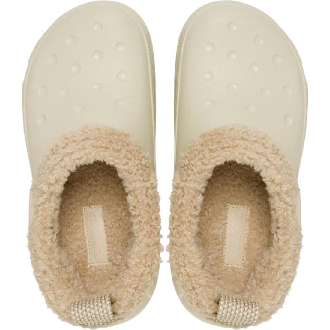A pair of Crocs Adults Classic Lined Shorty Clog in Sandstone Off White, featuring textured soles and warm tan faux fur lining around the opening, viewed from above., 198445245961, 198445245978, 198445245985, 198445245992, 198445246005, 198445246012, 1984
