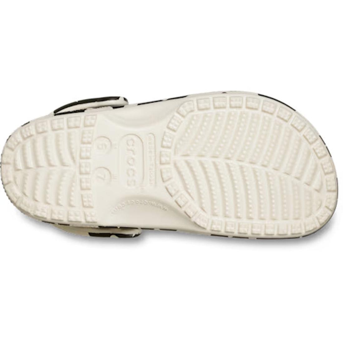 The image shows the white, textured sole of the Crocs Adults Classic Pop Petals Summit White Multi facing up, displaying its tread pattern and the Crocs logo embossed in the center—a perfect showcase of Crocs Comfort. This sole design complements popular 