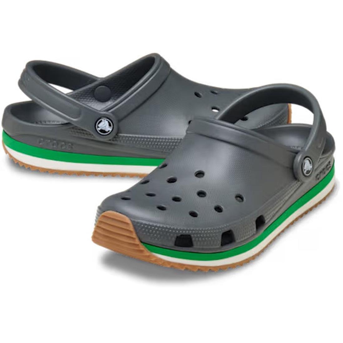 The Crocs Adults Crocband Runner Carbon With Gum Sole features a sporty gray design with ventilation holes, a back strap, and a thick sole accented by green and white stripes, plus a tan gum bottom for lightweight comfort.