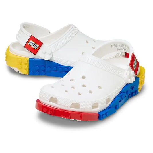 The Crocs Adults LEGO® Creativity Clog White Unisex features vibrant red, yellow, and blue LEGO brick designs on the soles, along with classic LEGO logos on the straps. These clogs capture the playful look of real LEGO pieces while delivering signature Cr