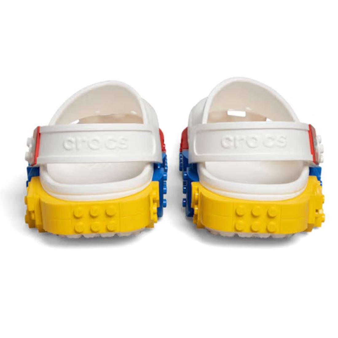 A pair of Crocs Adults LEGO® Creativity Clog White Unisex, featuring colorful LEGO brick-like blocks attached to the heels and sides, shown from the back., 52875, 198445332050, 198445332067, 198445332074, 198445332081, 198445332098, 198445331985, 19844533