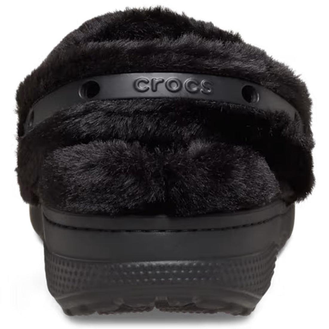 A close-up front view of the Crocs Adults Unfurgettable Lined Clog Black Fluffy, showcasing its plush fuzzy lining for cozy comfort and a black strap embossed with the Crocs logo., 198445190681, 198445190698, 198445190704, 198445190711, 198445190728, 1984