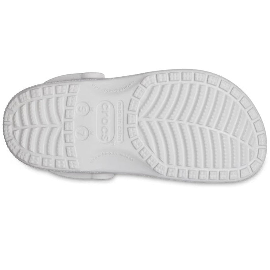 The image shows the bottom view of a Crocs - Classic Clog Adults Silver Glitter, featuring a patterned sole with grooves for grip. The Crocs brand name and size details are visible at the center., 196265542390, 196265542406, 196265542413, 196265542420, 19
