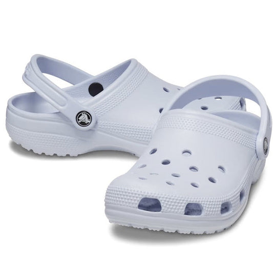 A pair of Crocs - Classic Clog Adults in Dreamscape Purple with ventilation holes, adjustable heel straps, and signature Crocs Comfort in a unisex style, displayed against a plain white background.