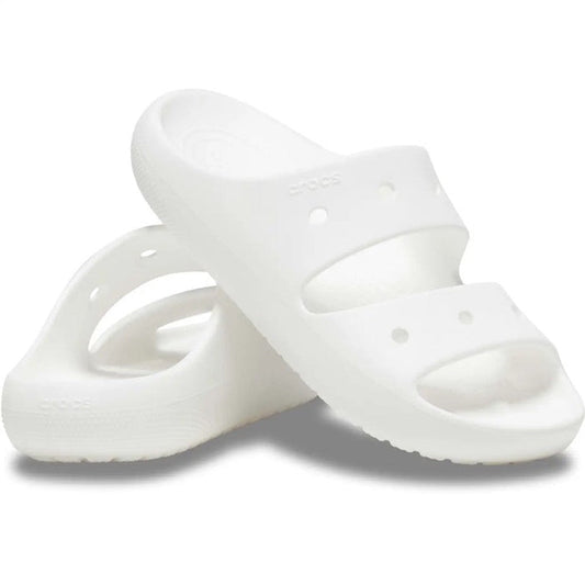 Crocs Classic Sandal V2 White for adults, with sturdy thick soles and two comfy wide straps. One sandal upright, one leaning close.  ksnz