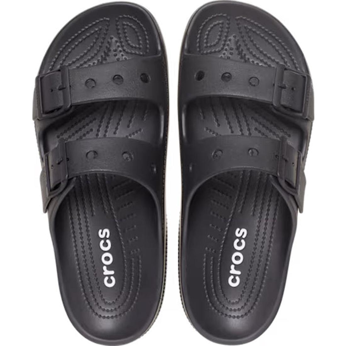 A pair of Crocs Womens Classic Saturday Sandal Slide Black, featuring two adjustable straps and textured insoles for comfort. The white Crocs logo is printed on the footbeds, seen from above., 198445397332, 198445397349, 198445397356, 198445397363, 198445