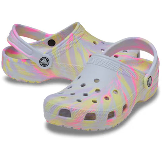 A pair of Crocs Kids Classic Clog Marbled Sky Ice Multi Youth featuring a white, yellow, and pink marbled pattern, a pivoting heel strap, and Iconic Crocs Comfort.