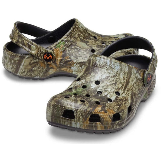 A pair of Crocs Classic Clog Realtree APX Adults Unisex camo clogs with ventilation holes and adjustable heel straps, shown on a white background, offer comfort and iconic style.