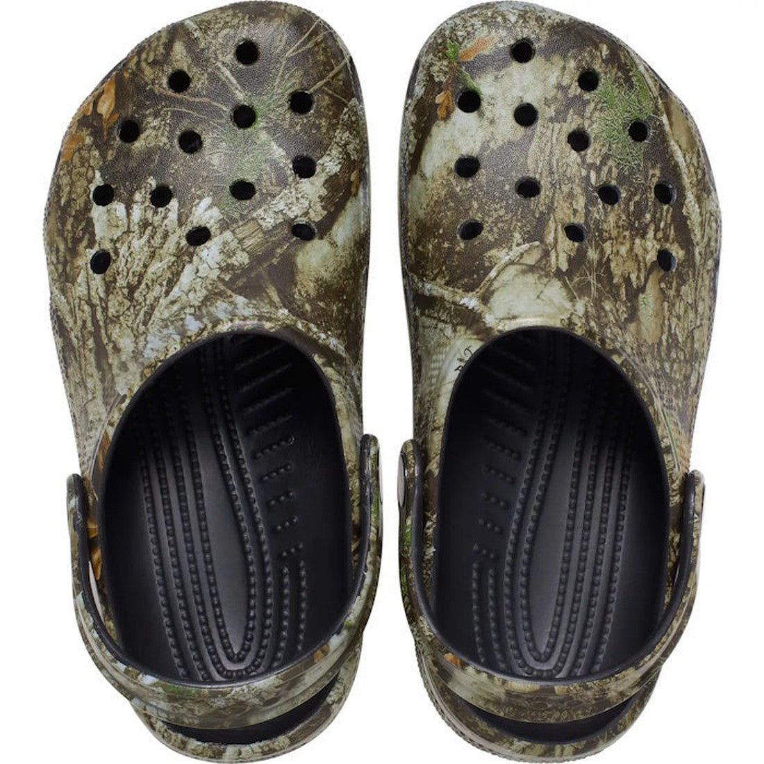 A pair of Crocs Classic Clog Realtree APX Adults Unisex is shown from above, displaying camouflage print, ventilation holes on top, and black textured footbeds inside., 196265803842, 196265803859, 196265803866, 196265803873, 196265803880, 196265803897, 19