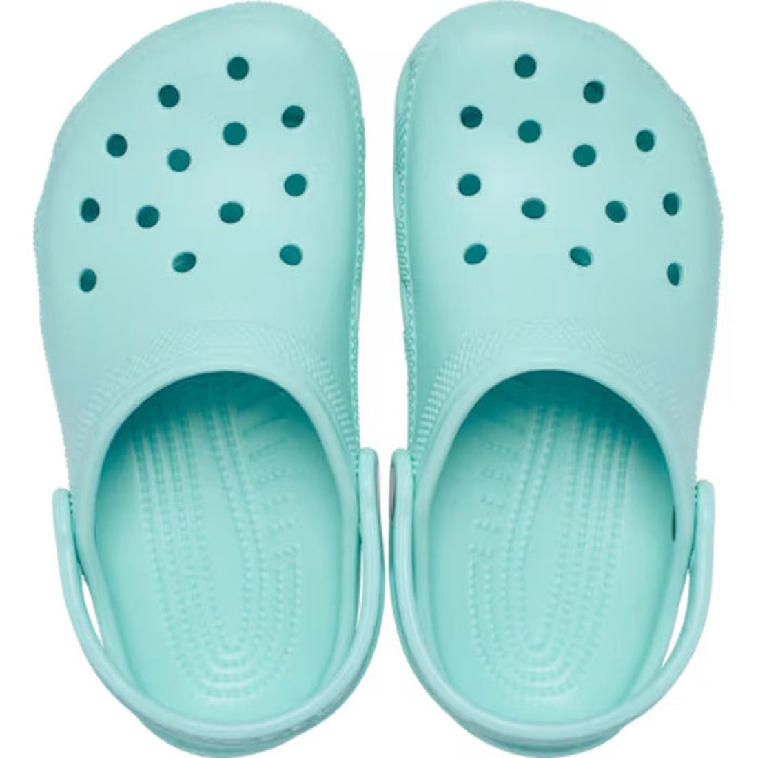 The Crocs Toddlers Aquamarine Classic Clog features ventilation holes and adjustable heel straps—these light blue, water-friendly sandals are perfect for toddlers., 51491, 51492, 198445197758, 198445197765, 198445197772, 198445197710
