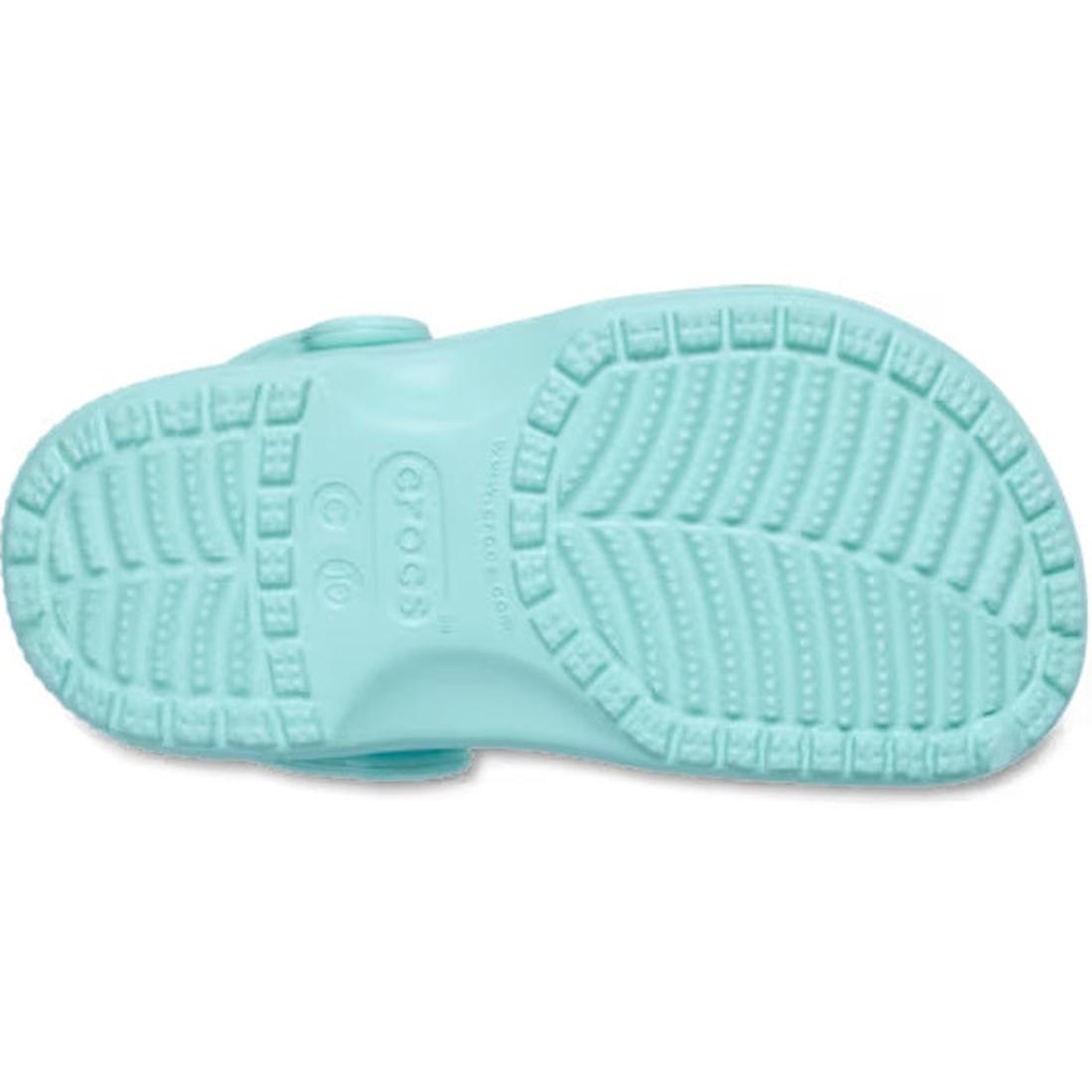 The image shows the sole of the Crocs Toddlers Aquamarine Classic Clog, featuring a textured tread with raised lines, dots, and the Crocs logo embossed in the center of this water-friendly sandal., 51491, 51492, 198445197758, 198445197765, 198445197772, 1