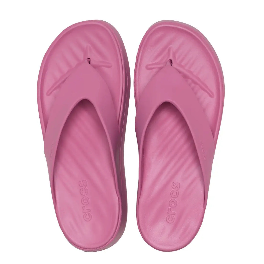 A pair of Crocs - Womens Getaway PLATFORM Flip Sandal in Quiet Rose Pink, featuring Free Feel Technology from the Crocs Getaway Collection, is shown from above on a white background.