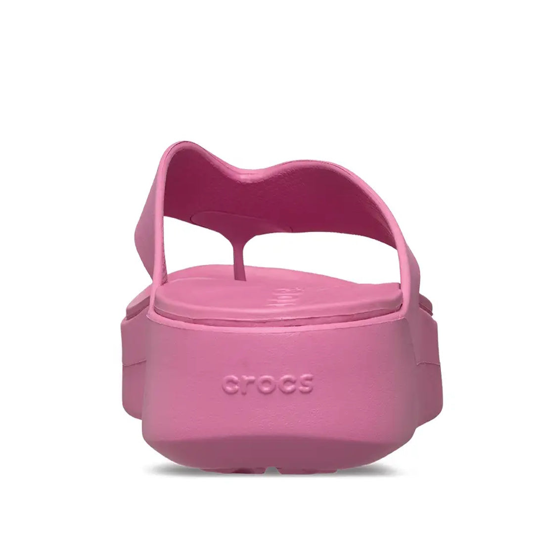 A rear view of a single Crocs - Womens Getaway PLATFORM Flip Sandal in Quiet Rose Pink, featuring a thick platform jandal sole and the Crocs logo on the heel. The sandal is set against a white background.